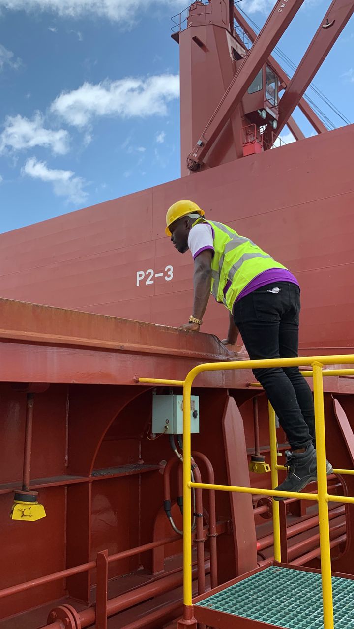 Staff climbing onto vessel